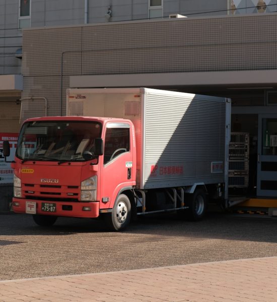 a red truck parked in front of a building